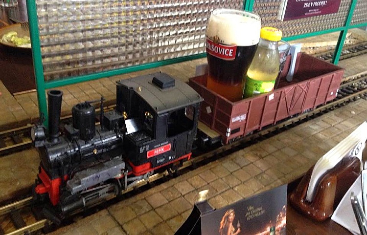 Drinks being served by trains in the Vytopna Restaurant