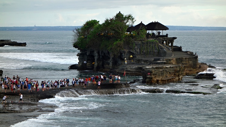 The reality of high season at the Tanah Lot Temple in Bali, Indonesia